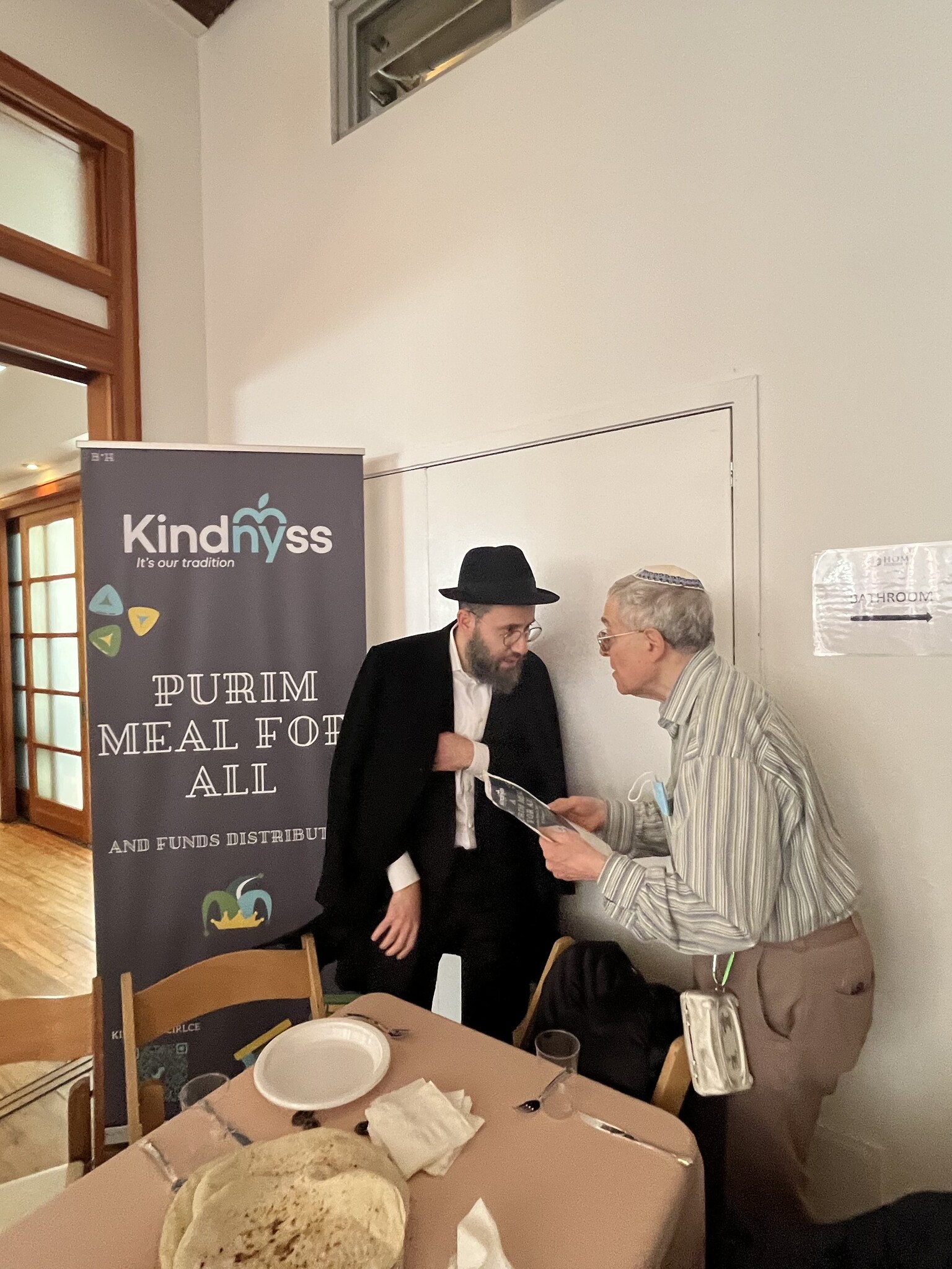Holding Matzah Sandwich